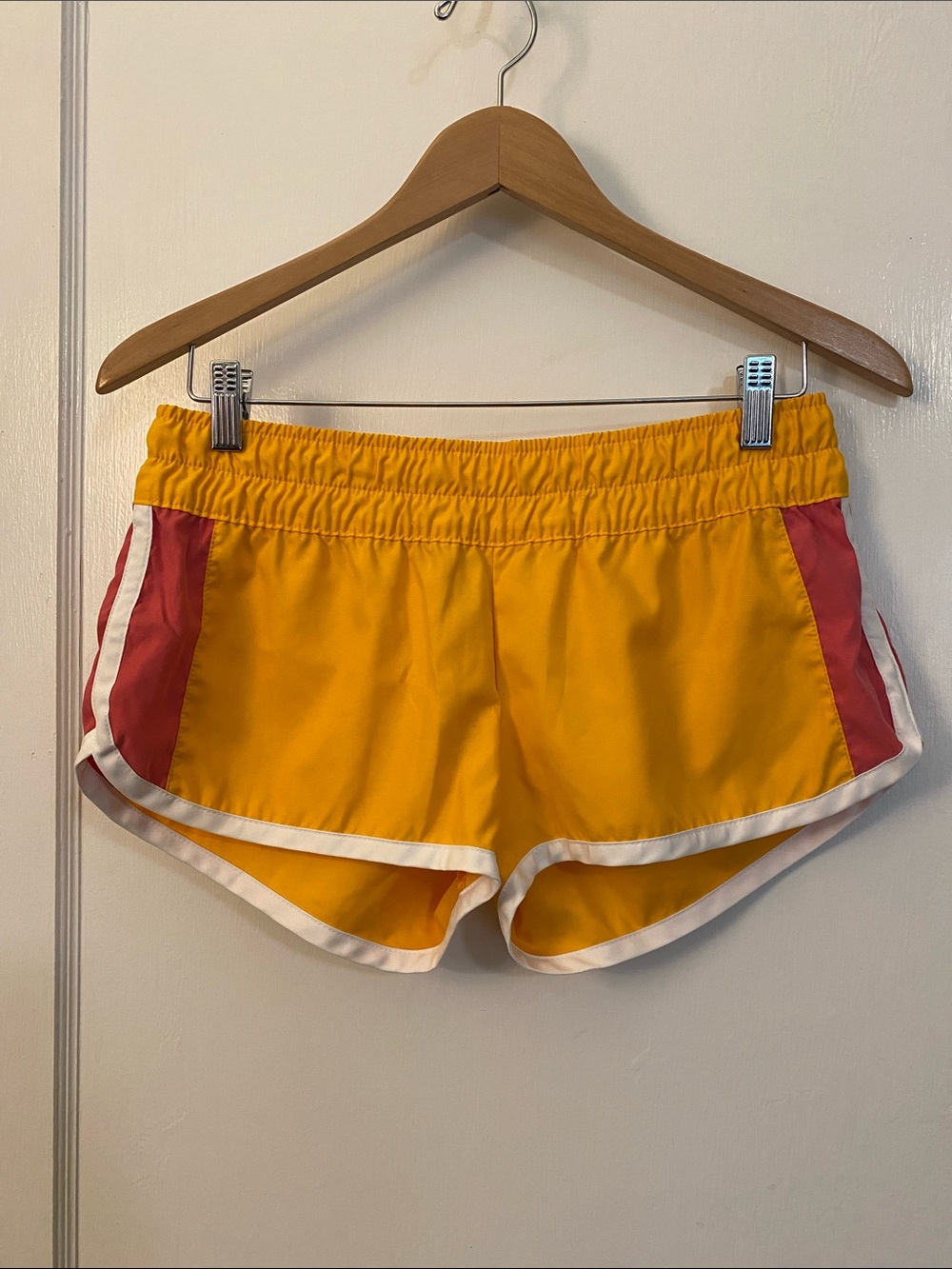 Nike Orange Shorts with Pink Side Panels and White Trim Women’s Small